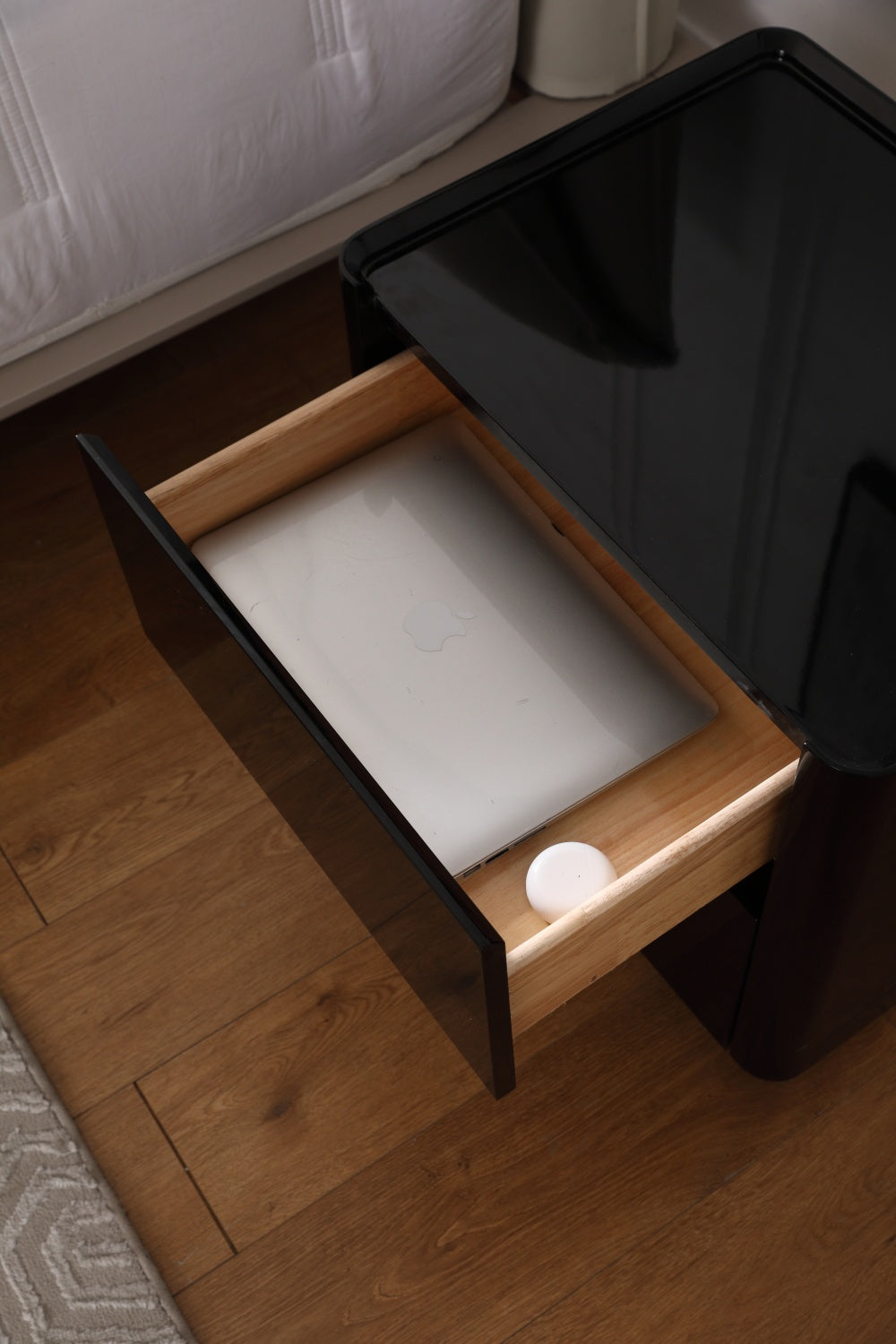 Glossy Lacquered Black Wood Nightstand with Warm Yellow Tone Sensor Lighting Strip